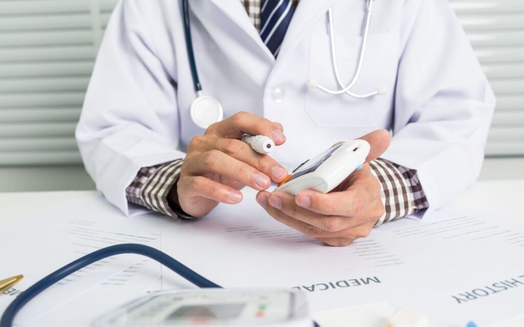 Confident doctor in white coat with stethoscope, ready to assist patients.