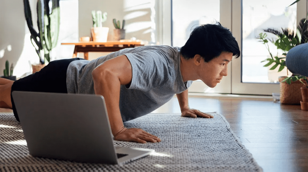 An Asian individual practicing low-intensity exercise in a serene setting.