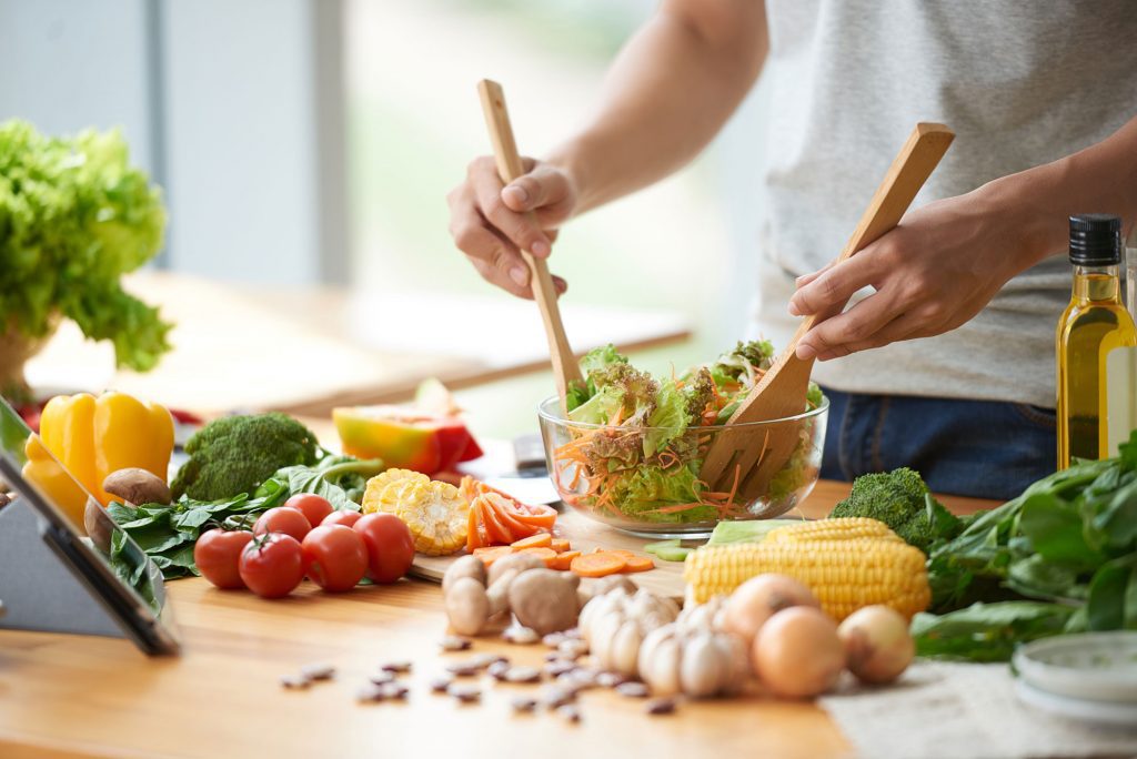 Plate filled with a variety of wholesome foods representing a balanced diet.